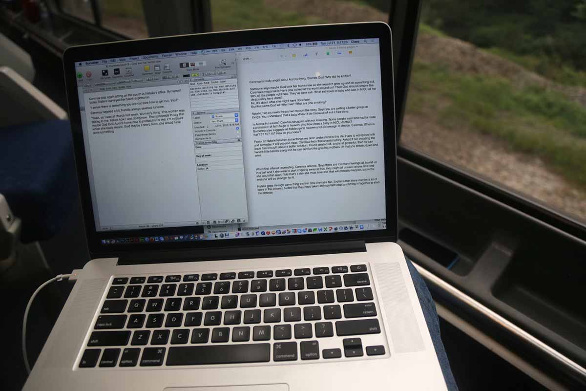 Computer on my lap in the sightseeing lounge car