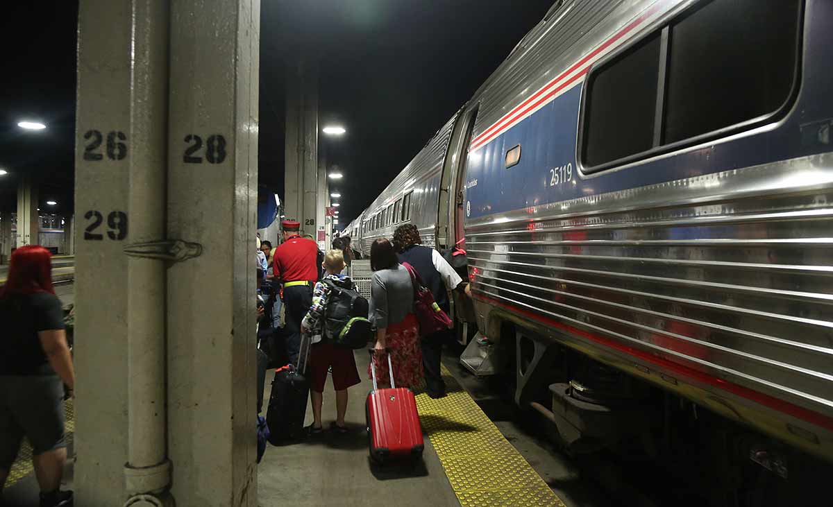 The Lake Shore Limited has arrived in Chicago and passengers are getting off onto the platform 