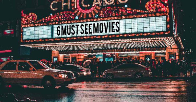 Movie theatre marquee, people in line outside