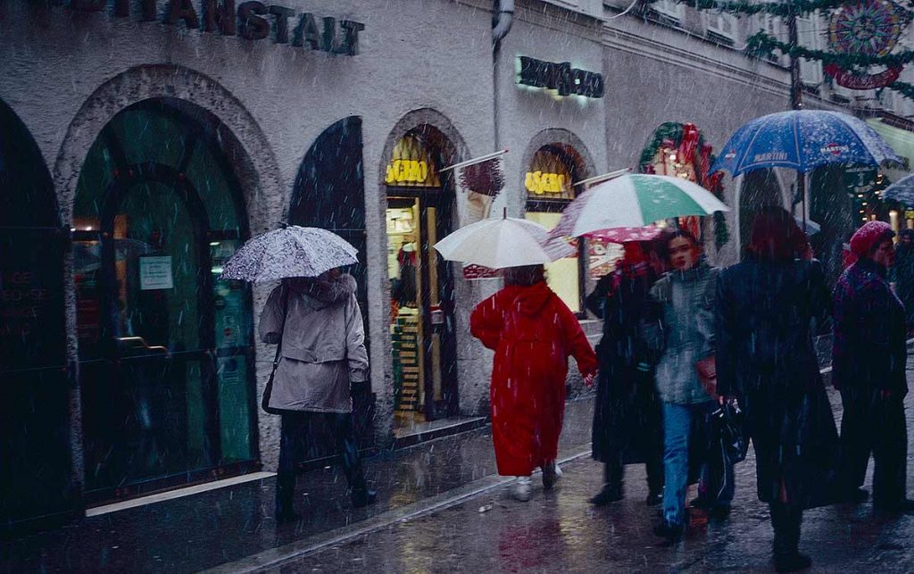 Salzburg street, pedestrians in snow