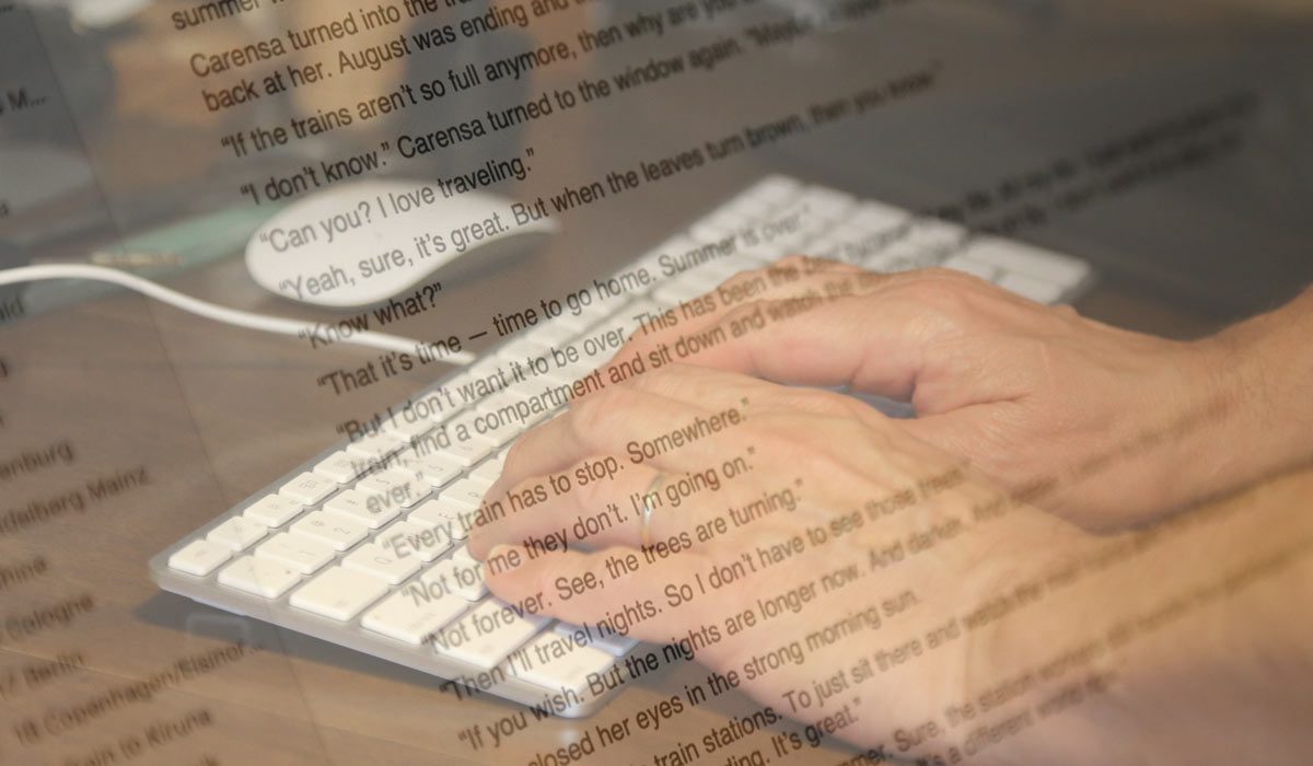Text on computer screen superimposed over image of hands on keyboard