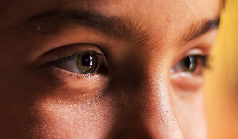 Closeup of eyes looking beyond the camera, seeing, perceiving