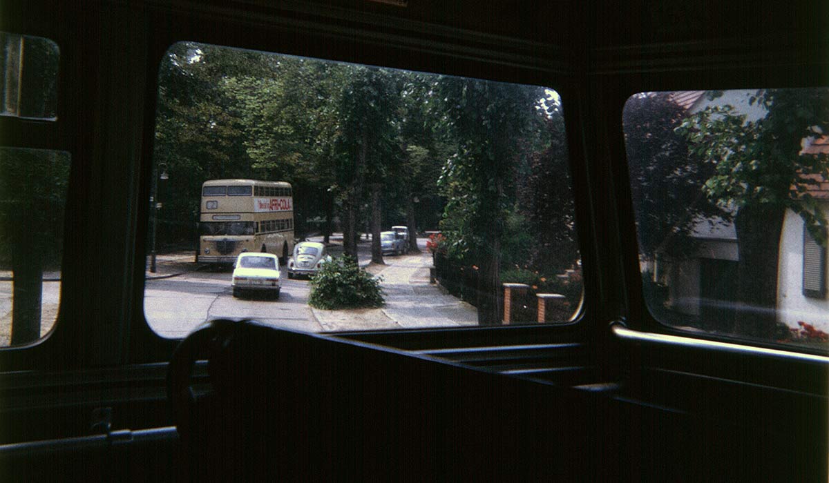 Berlin: double deck buses meet on narrow, curvy suburban street