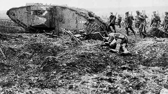 World War 1 battlefield - soldiers advancing behind a tank