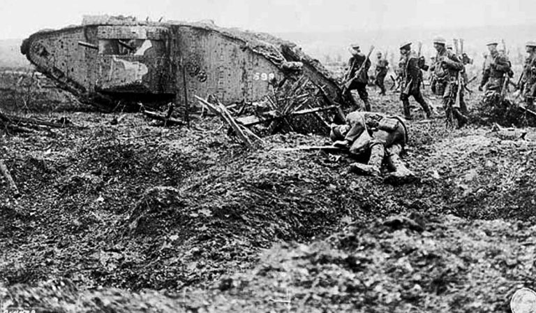 World War 1 battlefield - soldiers advancing behind a tank