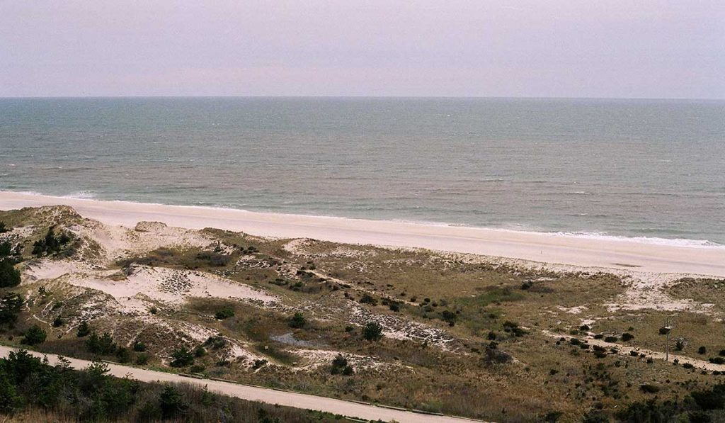 Fire Island, NY, sand dunes, beach and sea towards horizon