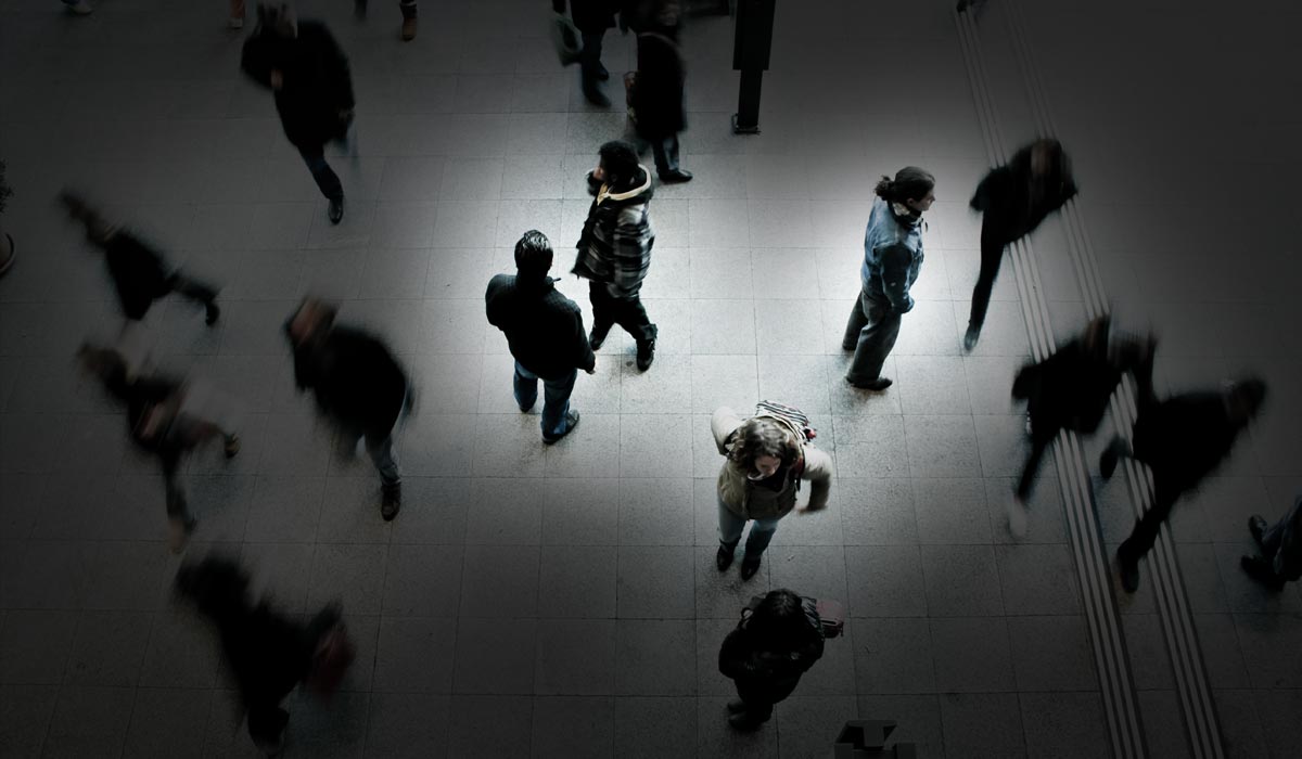 people looking outward at others passing by