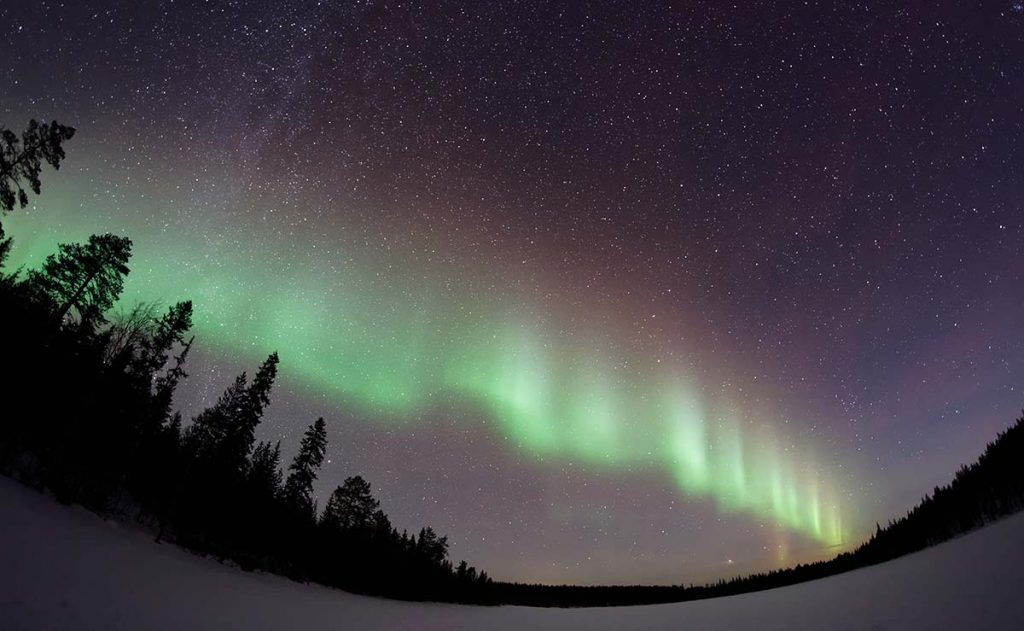 multi-colored curtain of Northern Lights in night sky