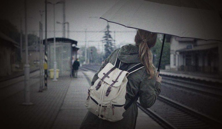 A train commute and an umbrella