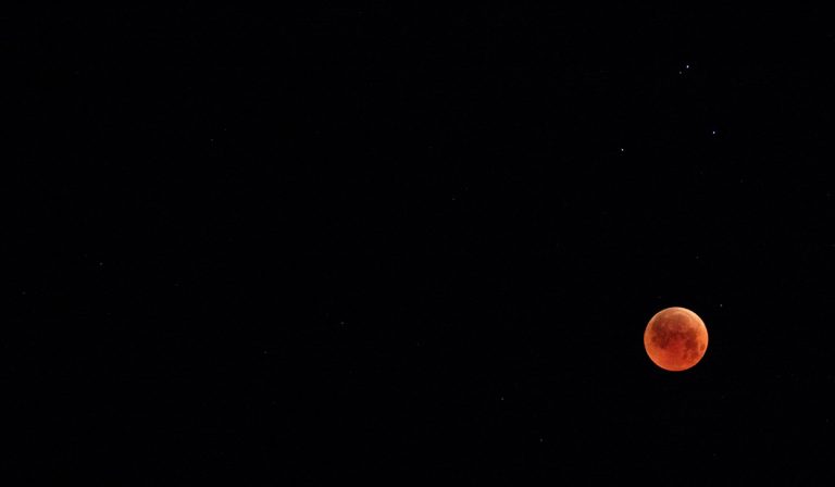 blood moon in black sky