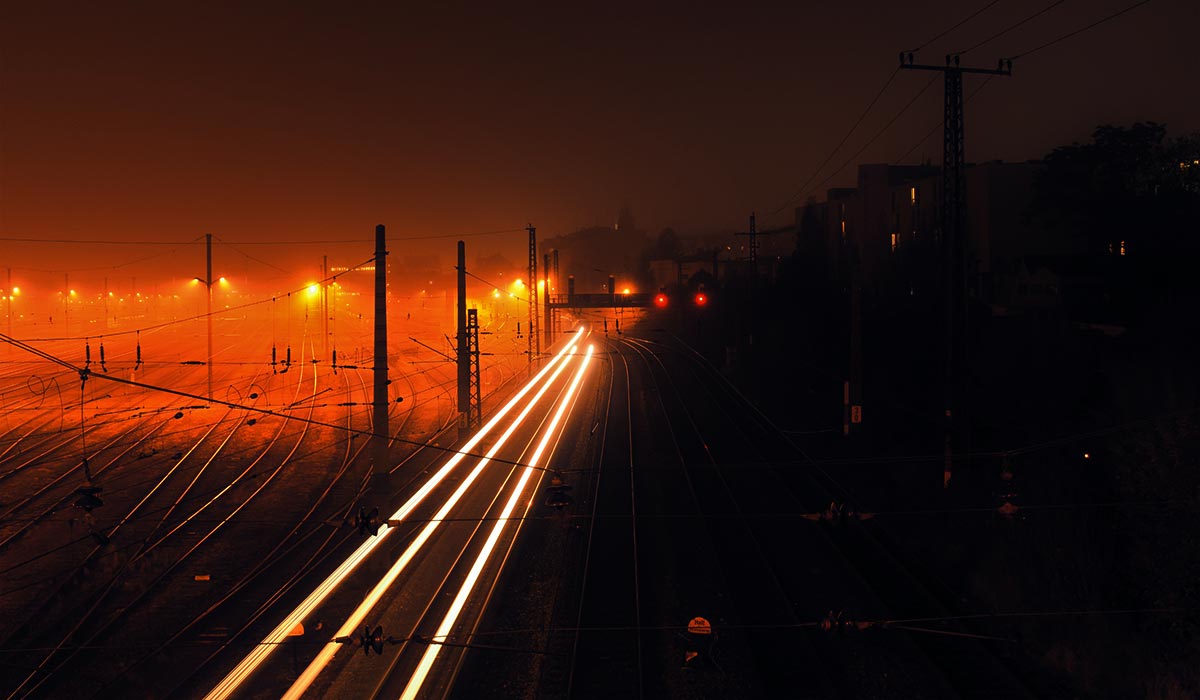 headlights of train, train tracks at night