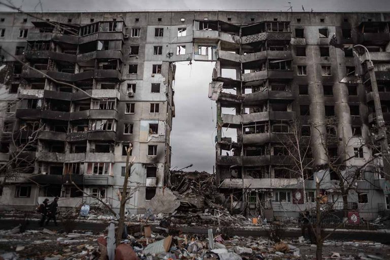 bombed out apartment building with middle part missing