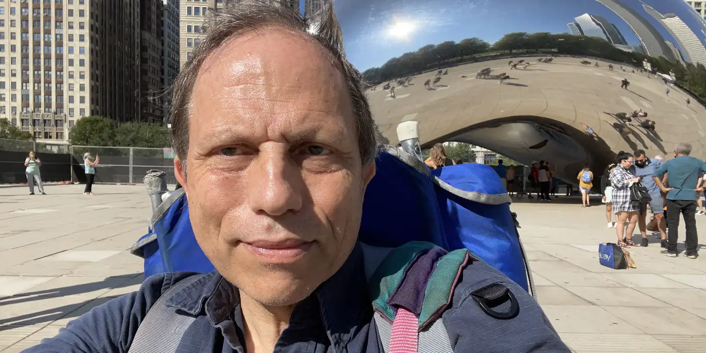 Claes Jonasson with backpack in front of the Bean in Chicago