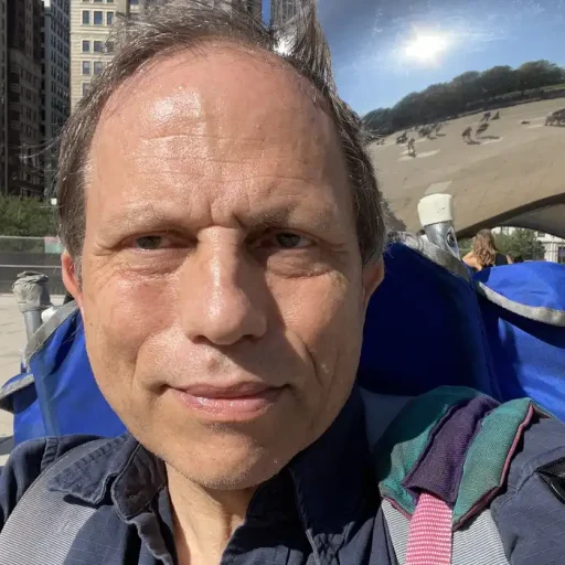 Claes Jonasson with backpack in front of the Bean in Chicago